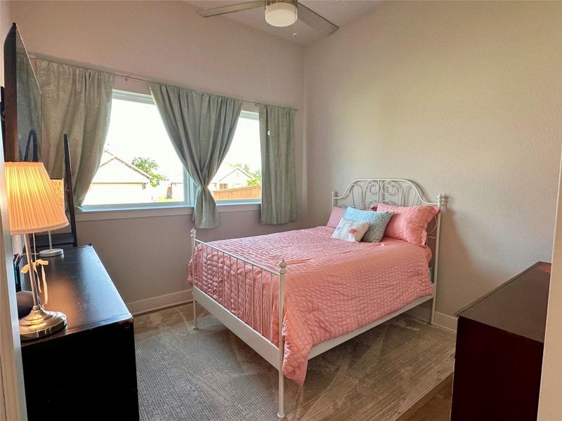 This room is actually a study with double french glass doors.  Used as a bedroom by owners.