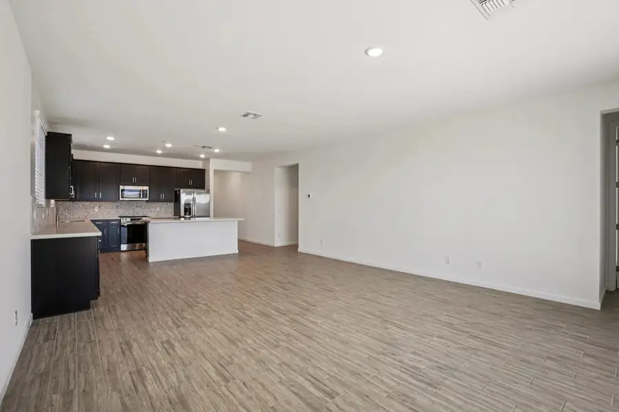Great room and kitchen. Not actual home, finishes may vary by community. Great room and kitchen. Not actual home, finishes may vary by community.