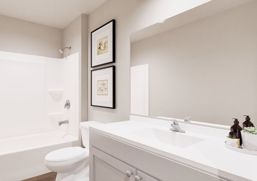 Modern bathroom featuring a white vanity, toilet, shower-tub combo, and framed artwork on the wall.