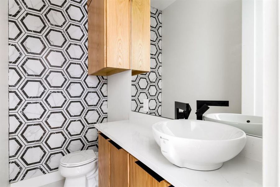 Bathroom featuring vanity and toilet Bathroom featuring vanity and toilet