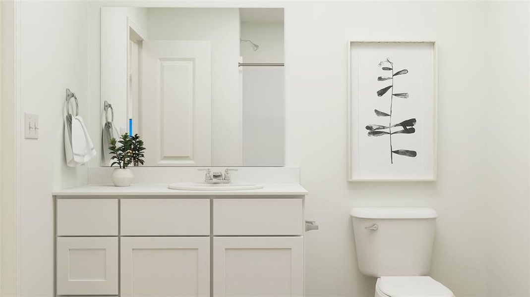 Bathroom featuring vanity and toilet Bathroom featuring vanity and toilet