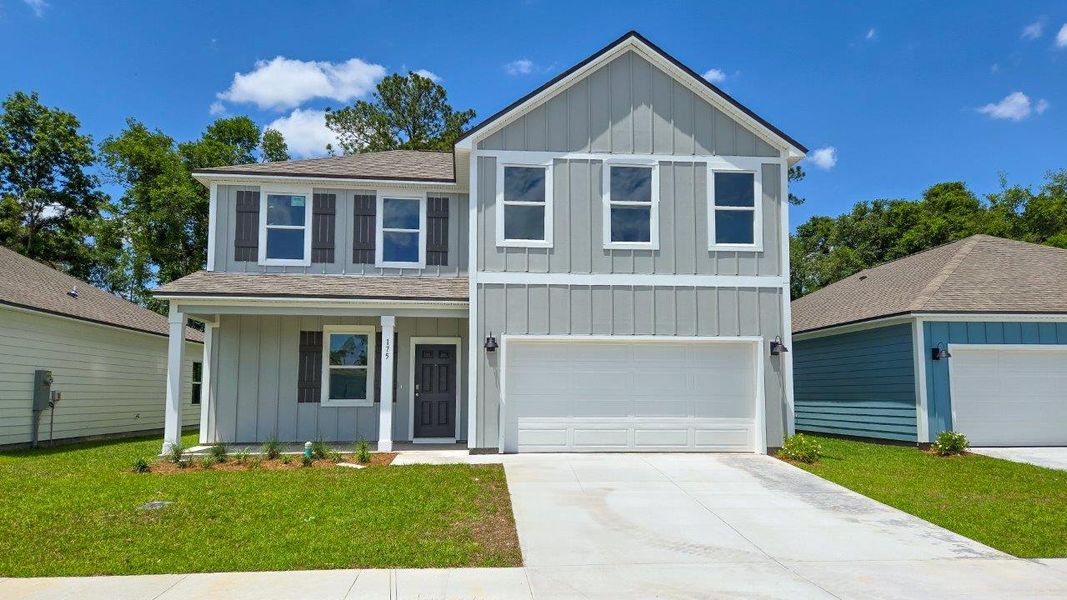 Front exterior of a new home in Misting Springs, Crawfordville, FL, highlighting curb appeal (Image 1).