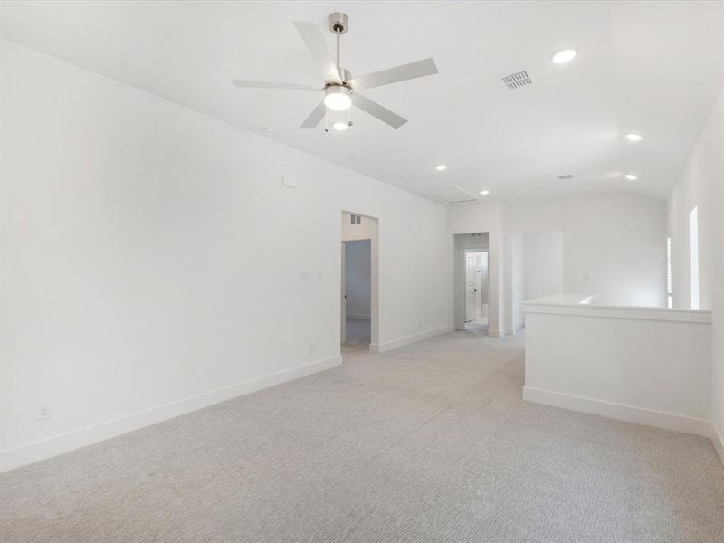 Game room featuring light carpet, recessed lighting, attic access, and a ceiling fan