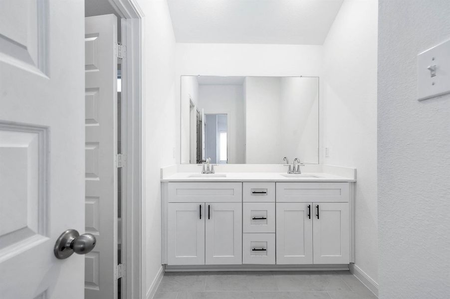 The 2nd floor full bath features dual vanity sinks, soaking tub and a standing shower. The 2nd floor full bath features dual vanity sinks, soaking tub and a standing shower.