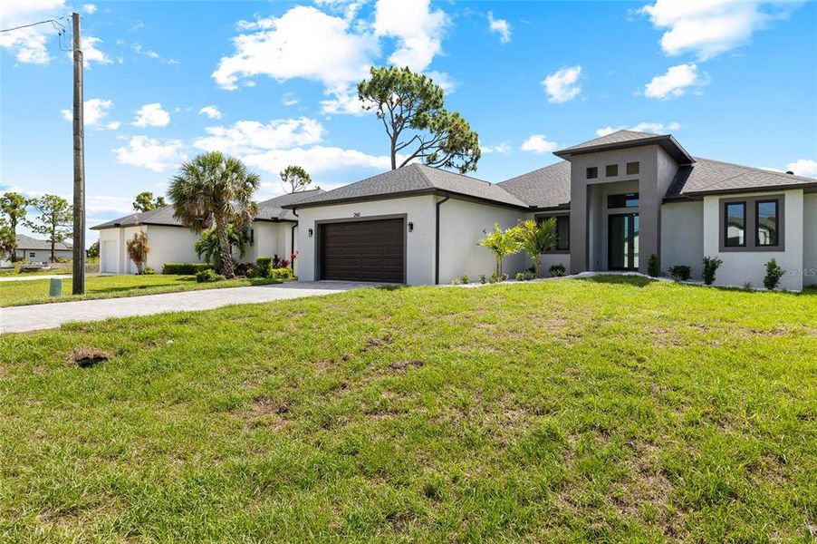 Front exterior of a new home in , Rotonda West, FL, highlighting curb appeal (Image 1). Front exterior of a new home in , Rotonda West, FL, highlighting curb appeal (Image 1).