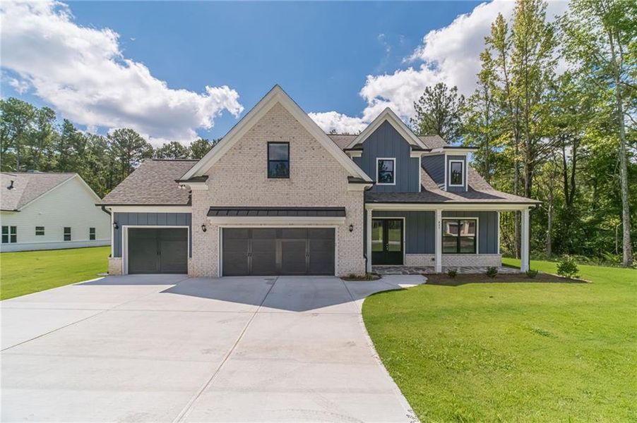 Front exterior of a new home in , Loganville, GA, highlighting curb appeal (Image 24).