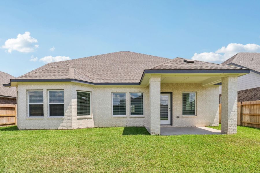 Front exterior of a new home in Kingdom Heights, Rosenberg, TX, highlighting curb appeal (Image 26). Front exterior of a new home in Kingdom Heights, Rosenberg, TX, highlighting curb appeal (Image 26).