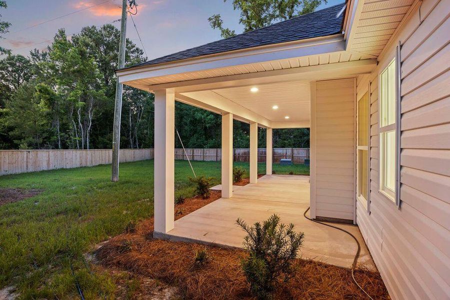 Exterior details and patio area of a home in , Awendaw (Image 37).