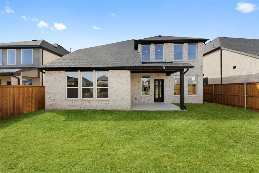 It's easy to take the party outside to this spacious covered back patio!