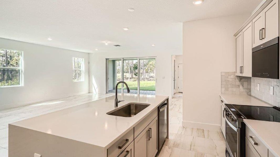 Representative furnished interior of a home built from the Ponte Vedra by D.R. Horton in Preserves at Park Trace, Stuart (Image 5).