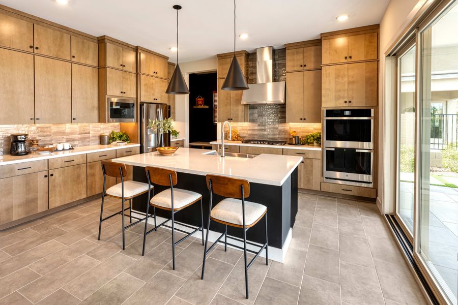 Representative furnished interior of a home built from the Willow Plan 40-9 by Tri Pointe Homes in Waterston Central, Gilbert (Image 10).