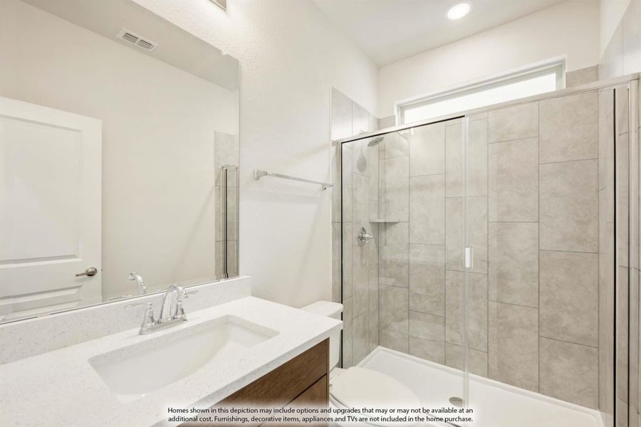 Bathroom with quartz vanity, wood cabinet, and walk-in glass shower with large tile walls Bathroom with quartz vanity, wood cabinet, and walk-in glass shower with large tile walls
