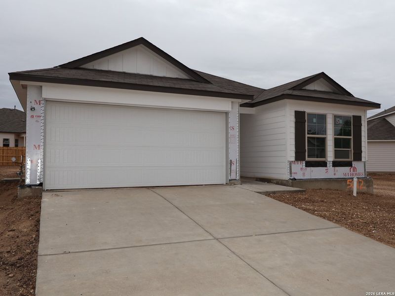 Front exterior of a new home in Agave, San Antonio, TX, highlighting curb appeal (Image 18).