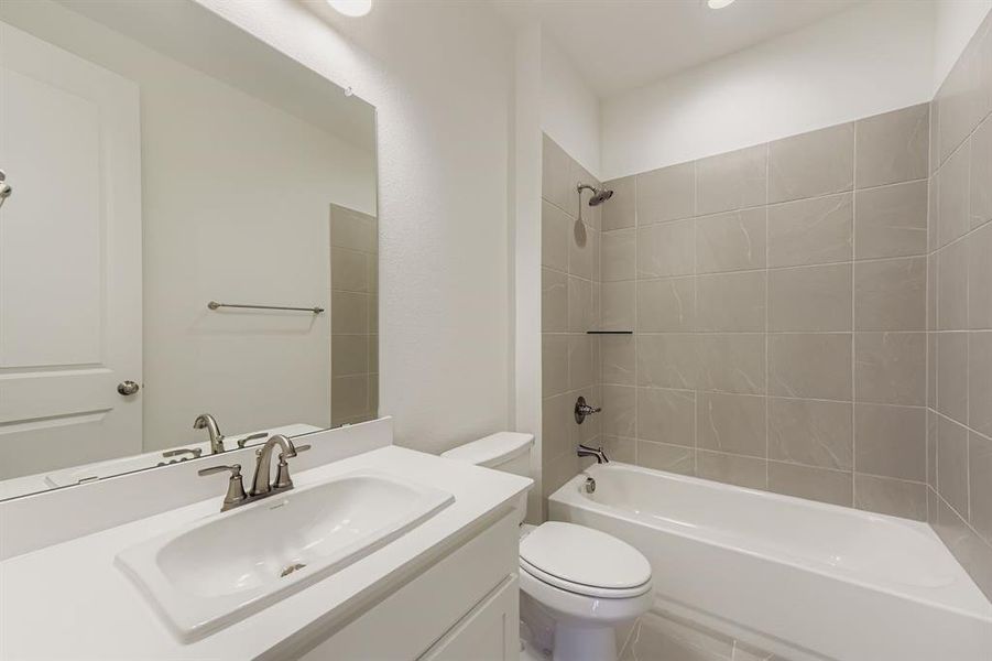 Bathroom with shower / bath combination and vanity Bathroom with shower / bath combination and vanity