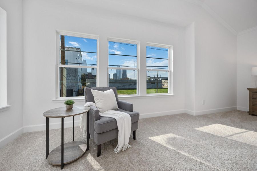 Bask in all-day sunshine thanks to walls of windows in this luminous bedroom. Whether you’re curling up with a book or sipping your first coffee—this space just feels good.