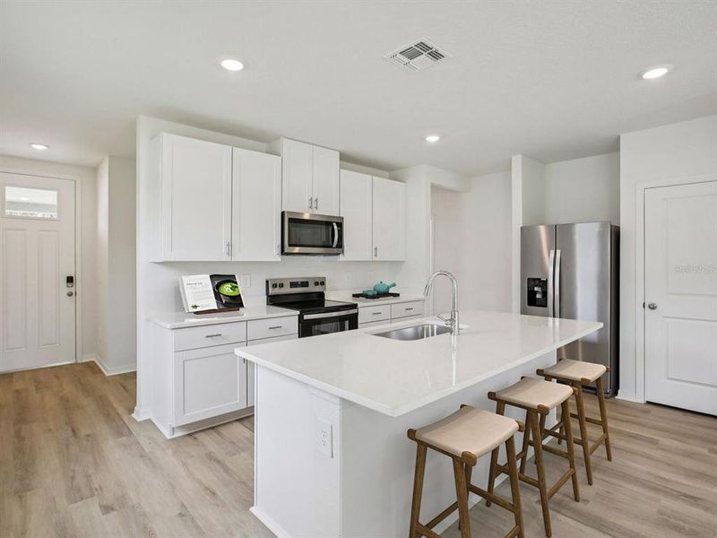 Furnished interior view inside a new home in The Grove at Stuart Crossing - Premier Series, Bartow (Image 8).