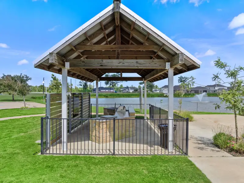 Front exterior of a new home in Woodshore, Clute, TX, highlighting curb appeal (Image 13).