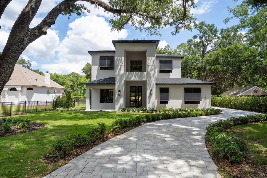 Front exterior of a new home in , Windermere, FL, highlighting curb appeal (Image 23).