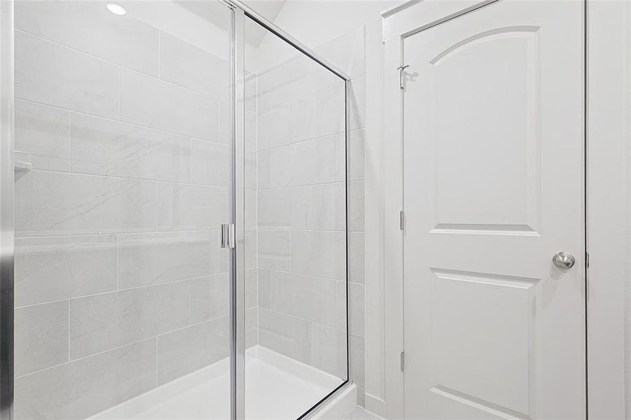 Bathroom featuring a shower with shower door