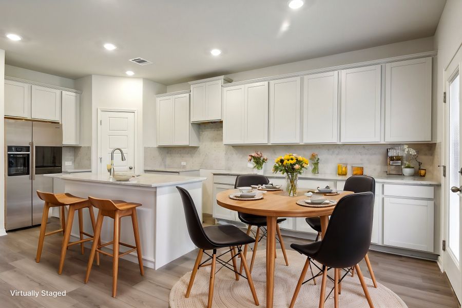 Virtually staged dining room in the Red River floorplan at a Meritage Homes community.