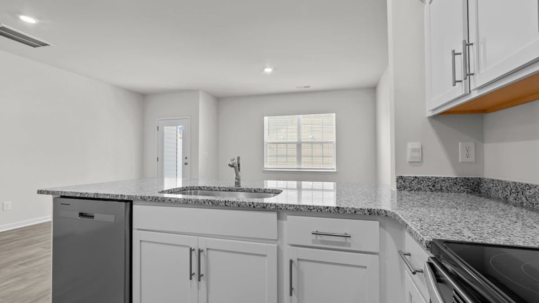 Furnished interior view inside a new home in The Townes at Ridgewood Farms, Winterville (Image 8).