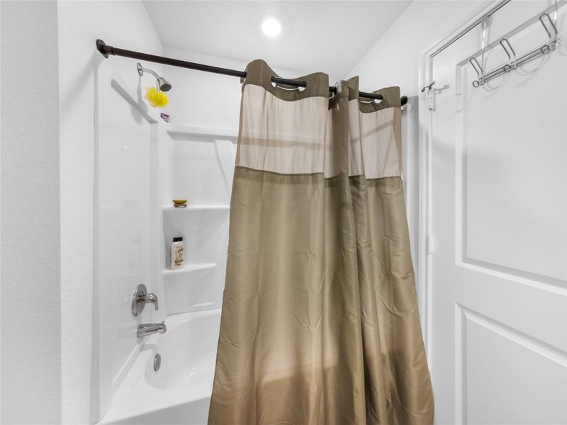 Bathroom featuring shower / tub combo