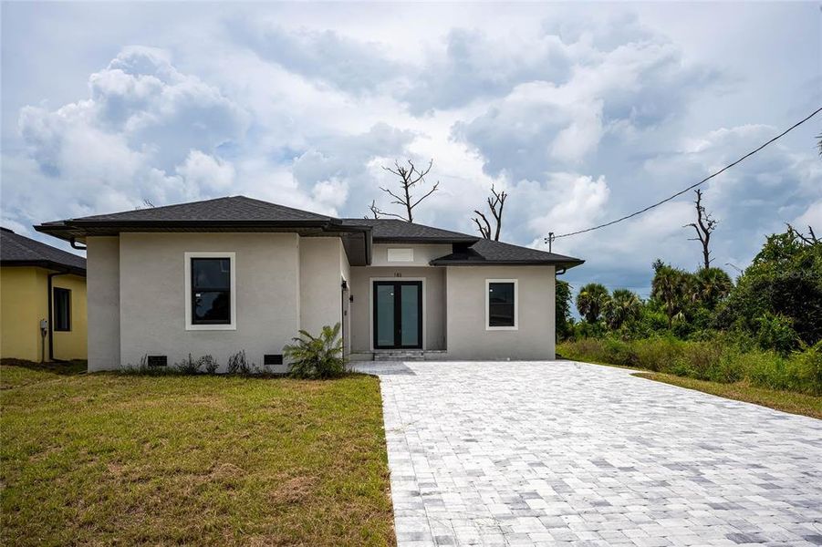 Front exterior of a new home in , Rotonda West, FL, highlighting curb appeal (Image 29).