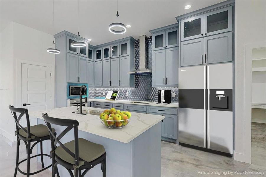 Kitchen with tasteful backsplash, wall chimney range hood, light stone counters, a kitchen island with sink, and appliances with stainless steel finishes