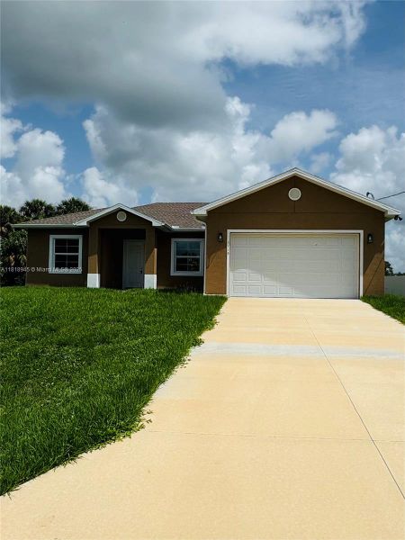Front exterior of a new home in , Labelle, FL, highlighting curb appeal (Image 1).