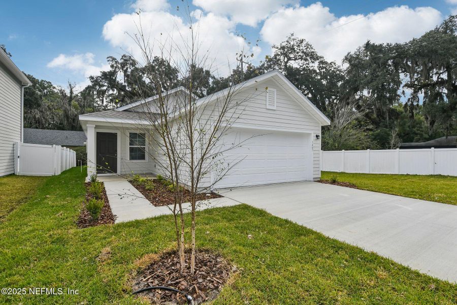 Front exterior of a new home in Kings Landing, Jacksonville, FL, highlighting curb appeal (Image 2). Front exterior of a new home in Kings Landing, Jacksonville, FL, highlighting curb appeal (Image 2).