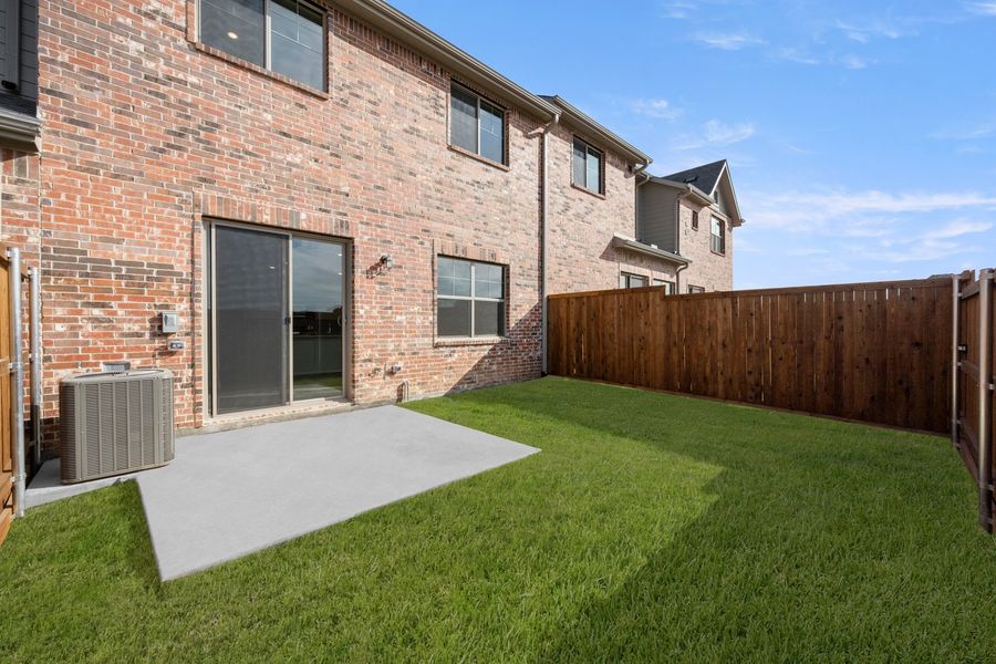 Exterior details and patio area of a home in Wildridge, Oak Point (Image 4).