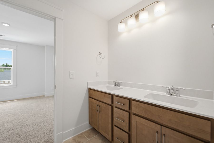Furnished interior view inside a new home in Aden Woods, Fairview (Image 16).