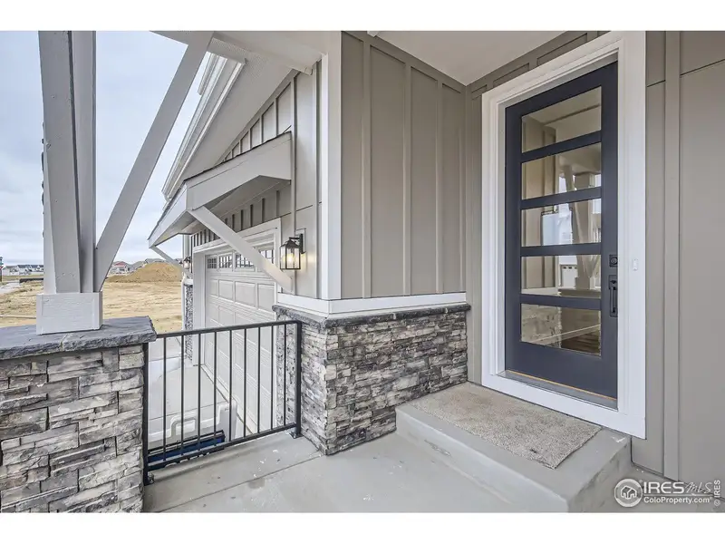 Exterior details and patio area of a home in RainDance, Windsor (Image 3).