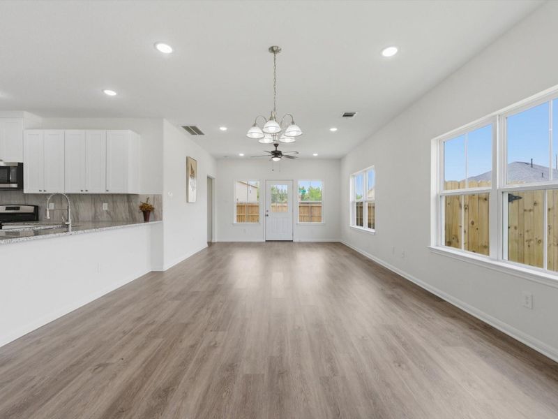 Designed for connection, the dining area offers an open and inviting setting ideal for weeknight dinners and special occasions alike.