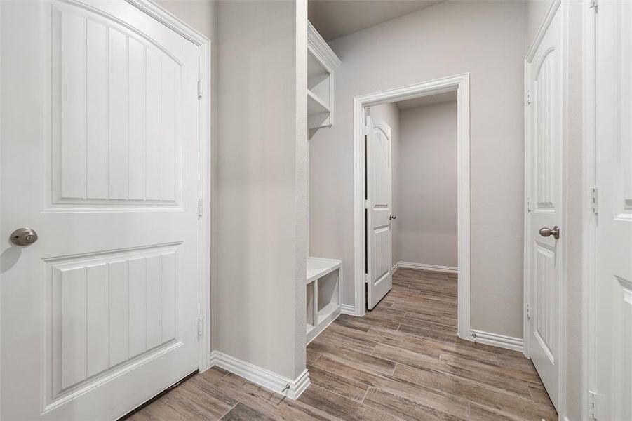Mudroom featuring wood finish floors and baseboards Mudroom featuring wood finish floors and baseboards