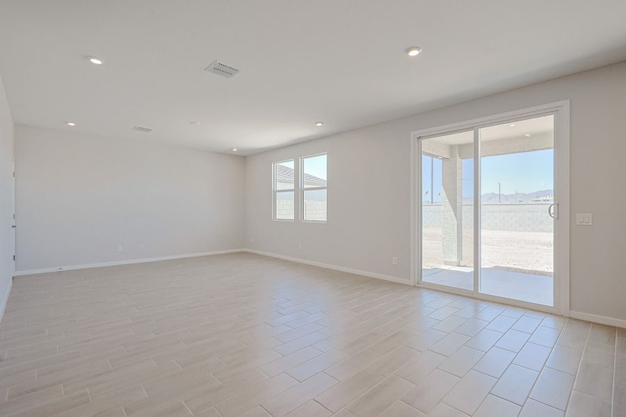 A room with a glass door and a wood floor.
