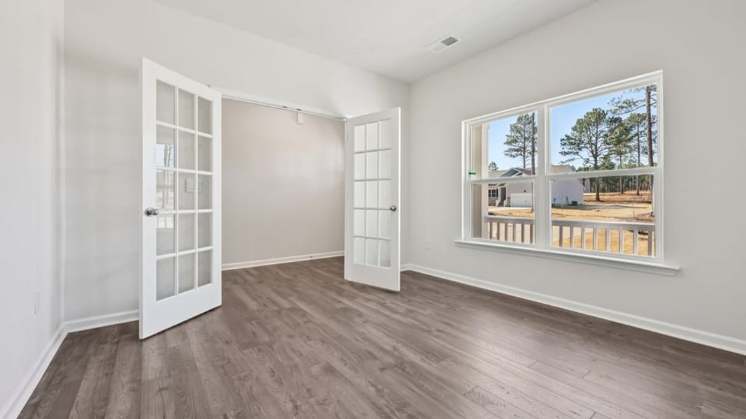 Spacious, unfurnished interior of a new home in Gretchen Pines, West End (Image 26).