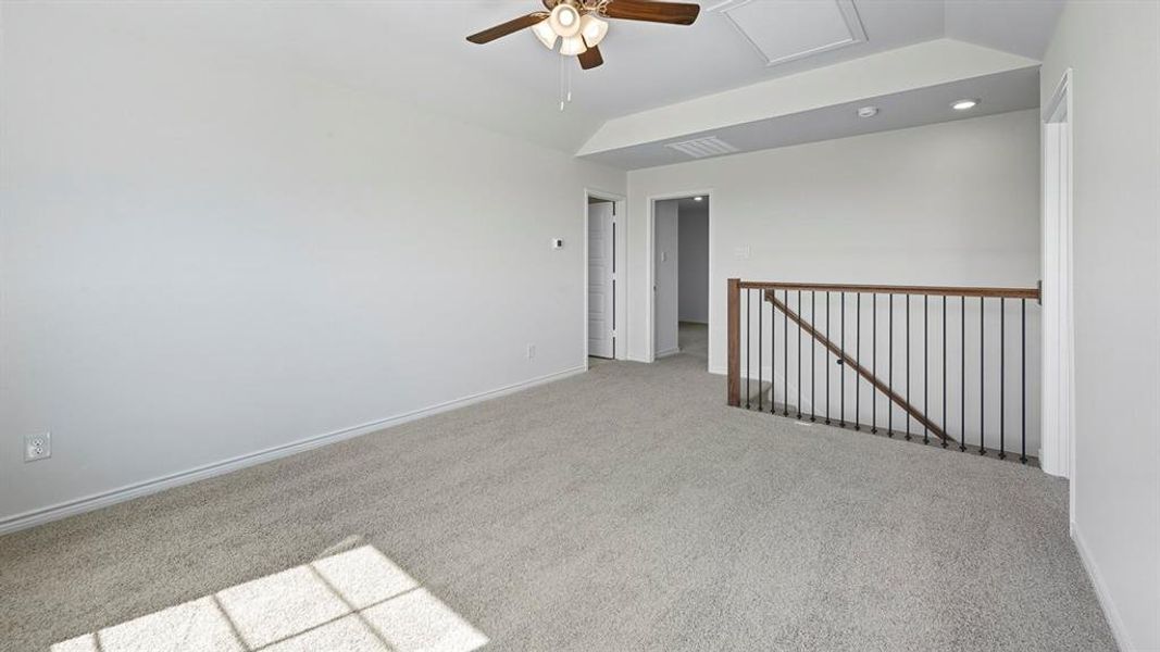 Carpeted spare room with lofted ceiling, ceiling fan, and recessed lighting