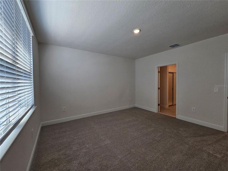 Spacious, unfurnished interior of a new home in The Reserve at Hammock Oaks - Signature Series, Lady Lake (Image 32).