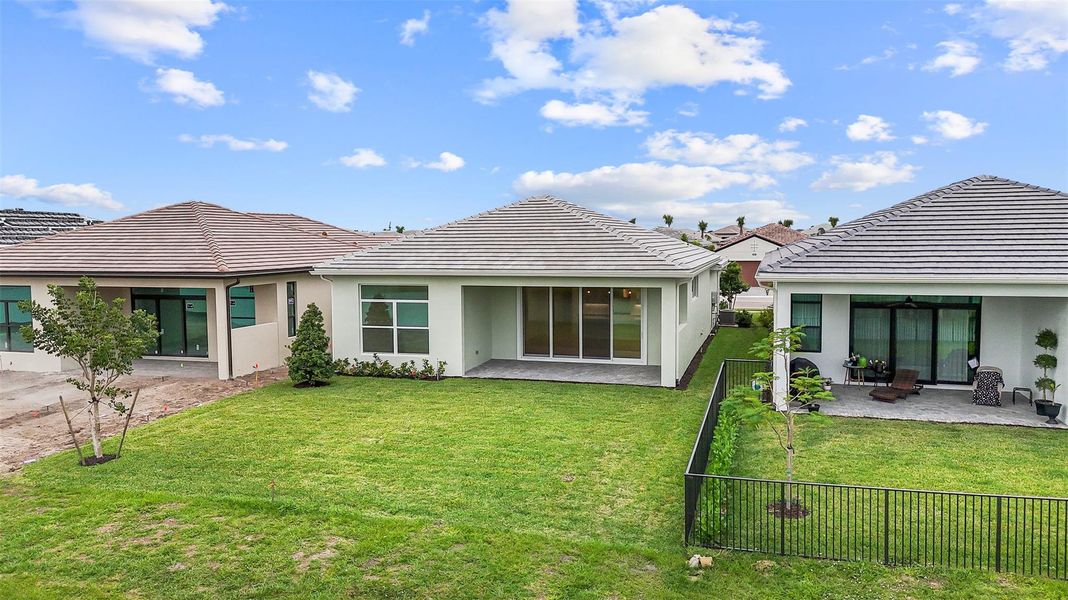 Exterior details and patio area of a home in Cresswind Palm Beach at Westlake, Westlake (Image 32).
