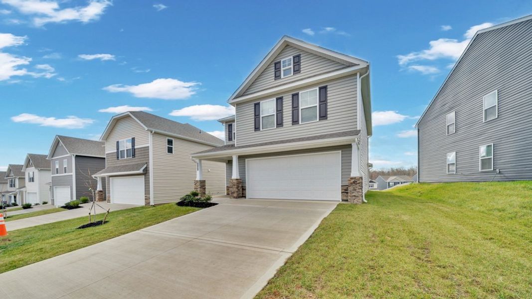 Front exterior of a new home in Johnson Farms, Greeneville, TN, highlighting curb appeal (Image 17).