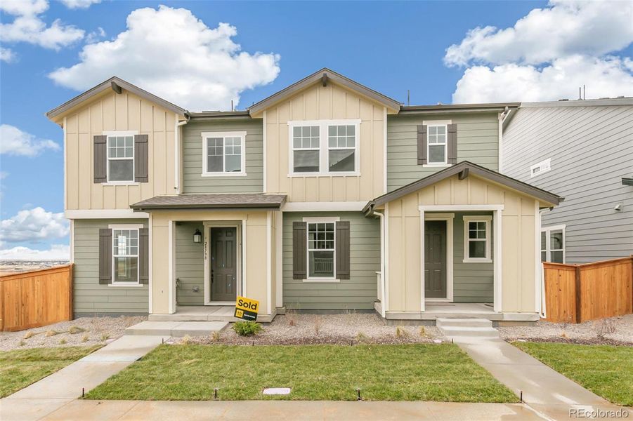 Front exterior of a new home in , Watkins, CO, highlighting curb appeal (Image 23).
