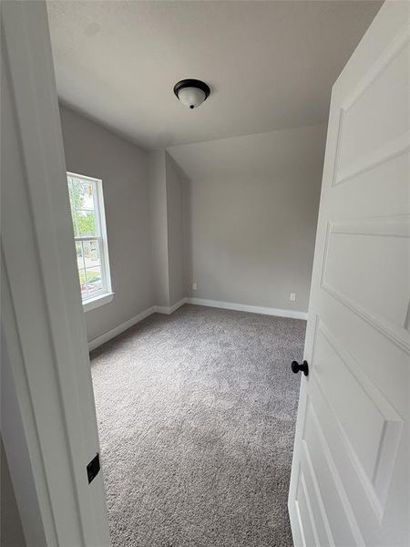 Neutral wall paint, plush grey carpeting, and white trim create a clean aesthetic Neutral wall paint, plush grey carpeting, and white trim create a clean aesthetic