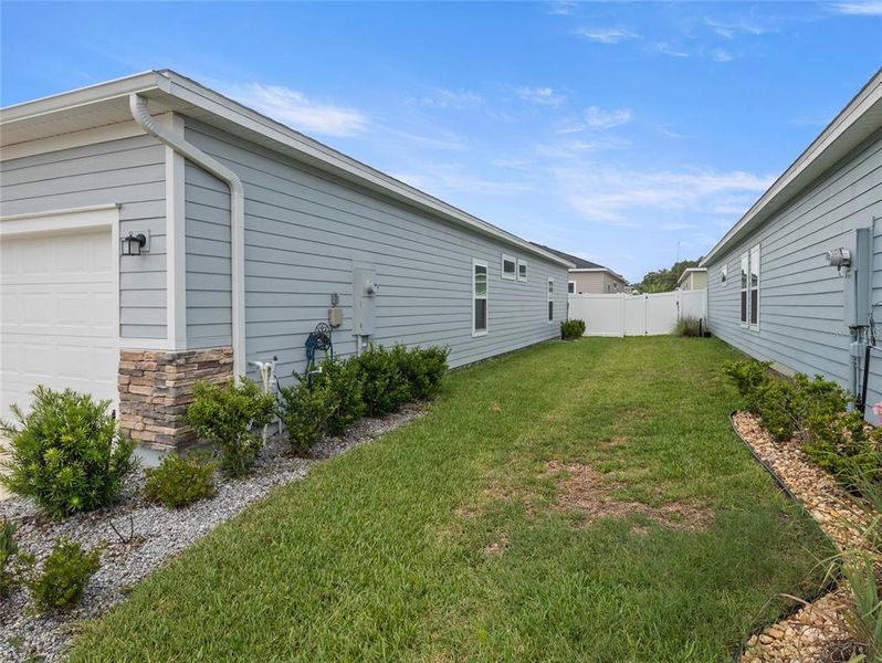 Where line is in yard with the green grass is address yard.