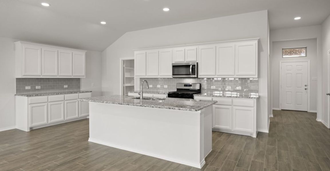 Representative exterior photo of a completed home built from the Lincoln by Impression Homes in Baker Farms, Cleburne, TX (Image 5).