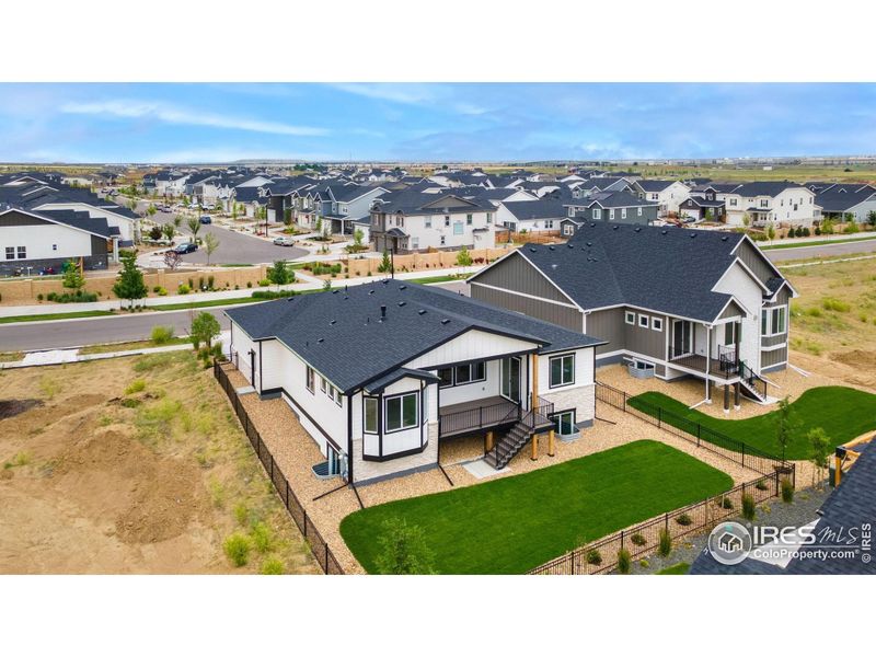 Front exterior of a new home in Aurora Highlands, Aurora, CO, highlighting curb appeal (Image 30).