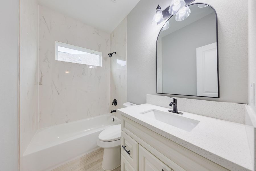 Second bath featuring a convenient tub/shower combo, offering versatility and comfort for the whole family. Second bath featuring a convenient tub/shower combo, offering versatility and comfort for the whole family.