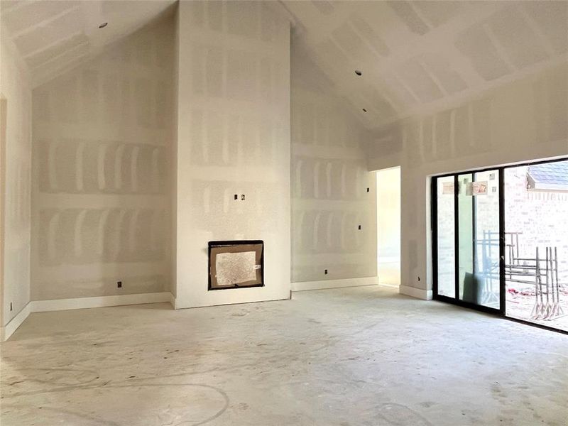 Dramatic family room with a vaulted ceiling.