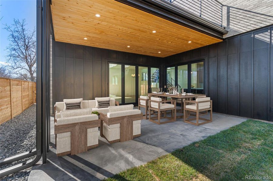 Dine alfresco or enjoy morning coffee with direct access to the kitchen and living room.Virtually staged.