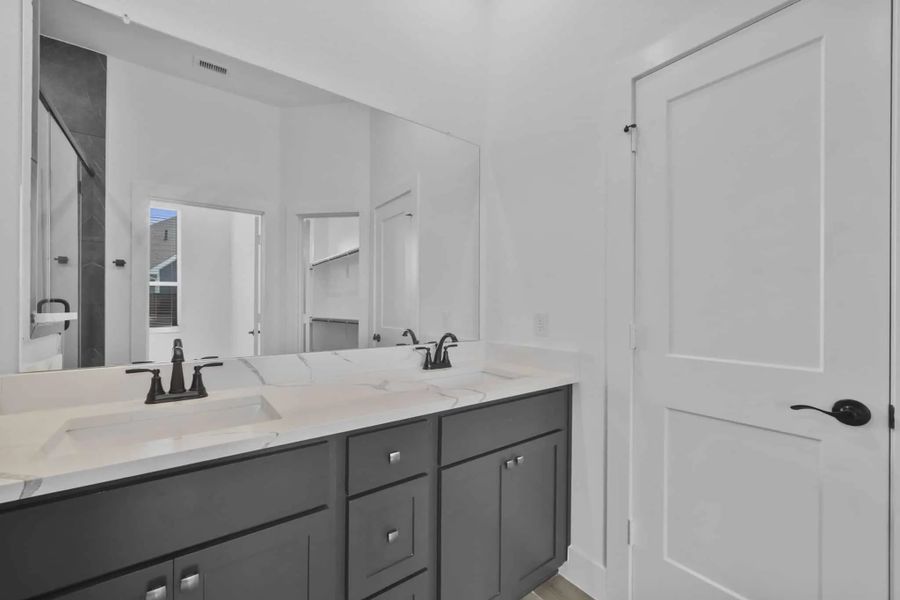Representative furnished interior of a home built from the Versailles by Chesmar Homes in Meridiana Chateau, Manvel (Image 12).